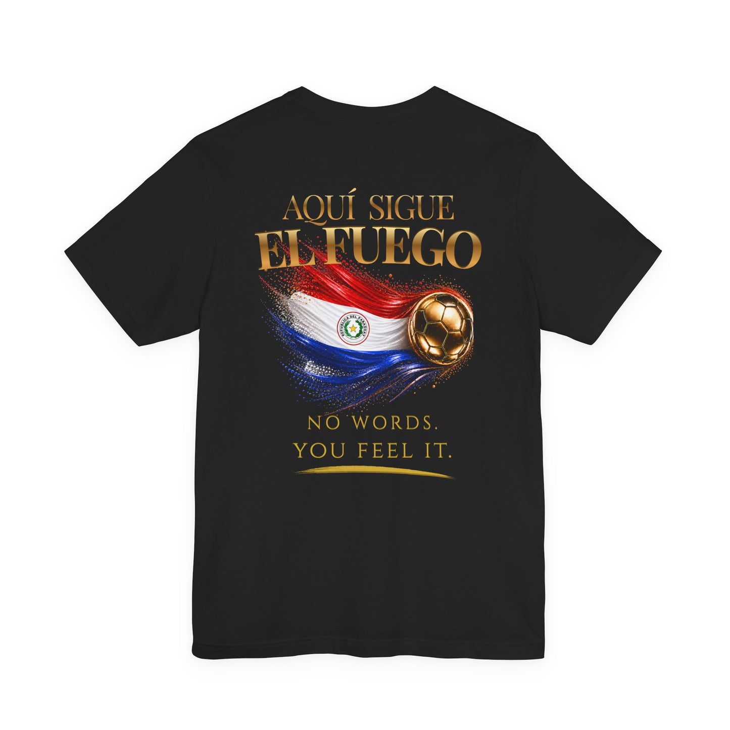 Aquí Sigue El Fuego Tee | Gold Soccer & Paraguay Flag Design | Bilingual Edition | Back Print