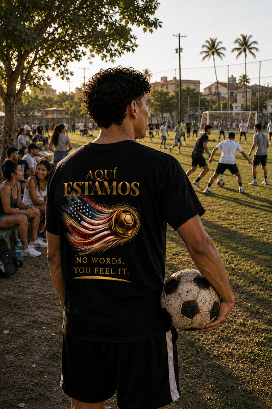 Aquí Estamos Tee | Gold Soccer & United States Flag Design | Bilingual Edition | Back Print